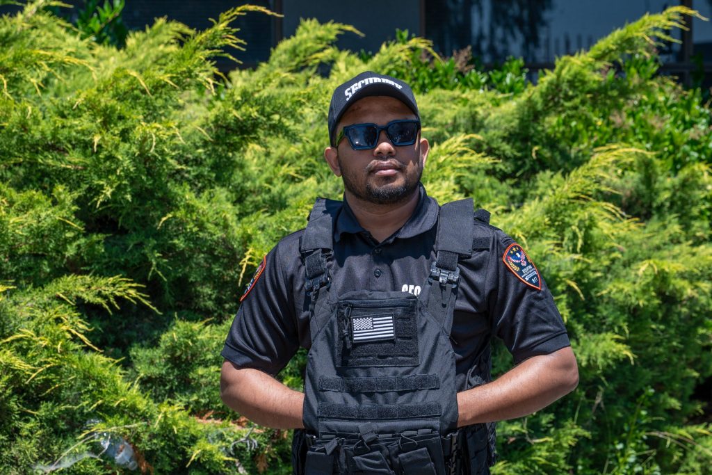 Armed Equitab Protective Services officer in tactical uniform